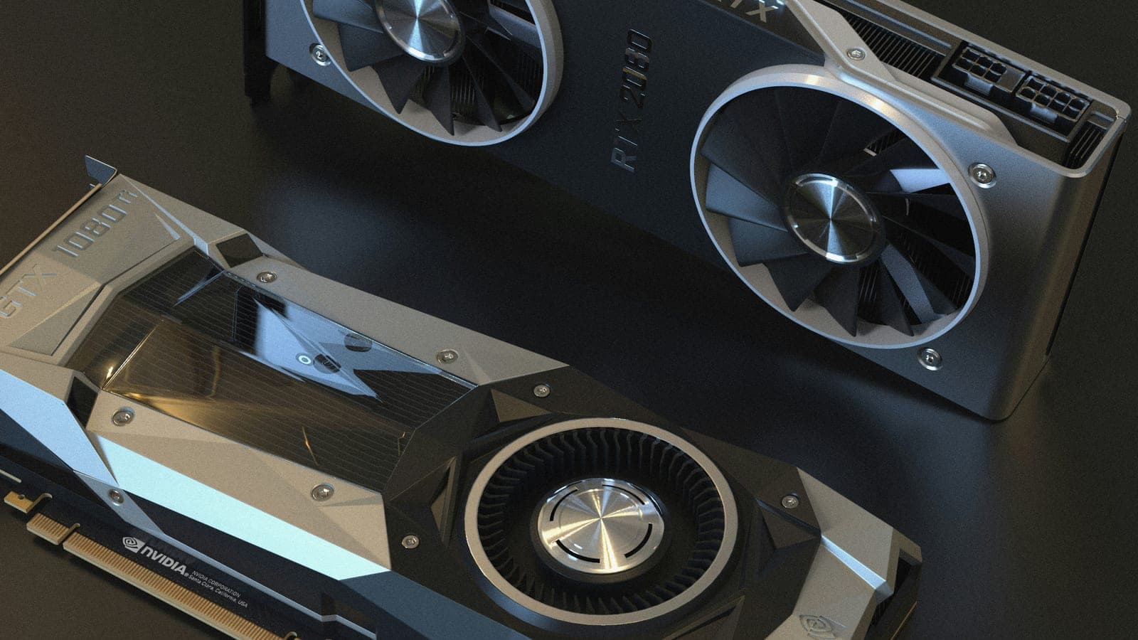 Two NVIDIA graphics cards with exposed cooling fans on a dark surface.