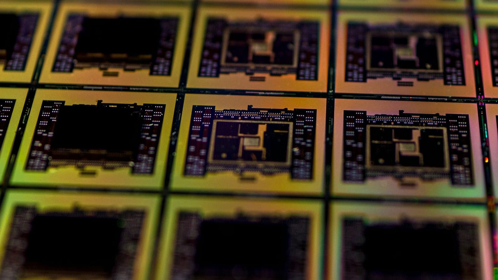 Close-up of patterned silicon dies on a prototype wafer.